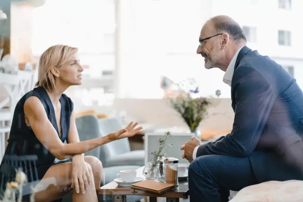 businessman and woman having a meeting in a coffee 2022 03